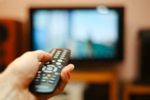 Watching,Tv,And,Using,Remote,Controller
